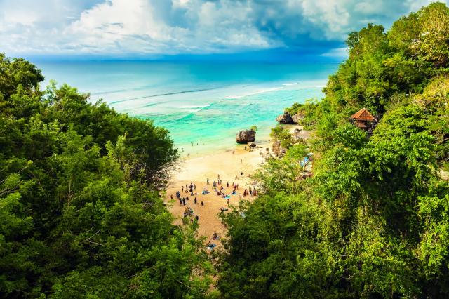 Scenic coastal landscape of high cliff at sunset near Uluwatu T