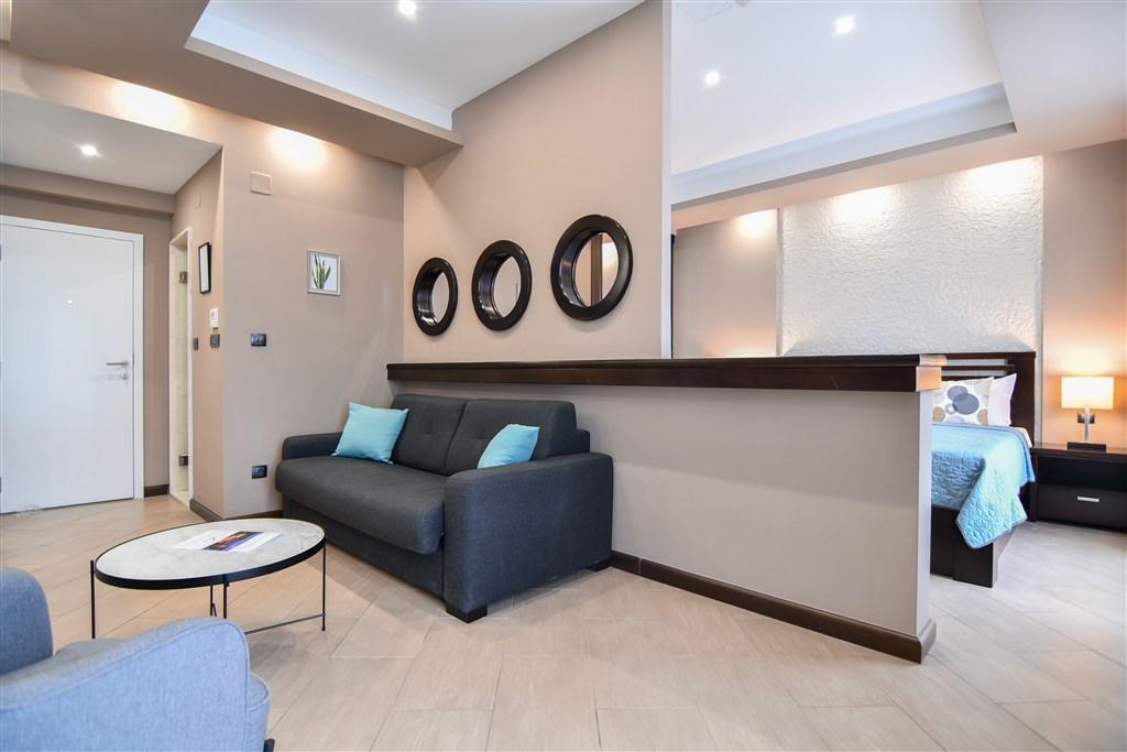 dvoulůžková ložnice a denní místnost - typ Apt. 2+2 Superior