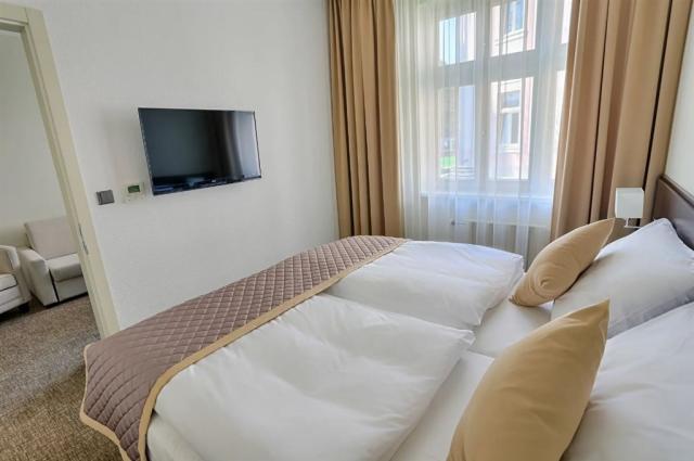 dvoulůžkový pokoj a denní místnost - typ Apartmán 2(+1) Comfort