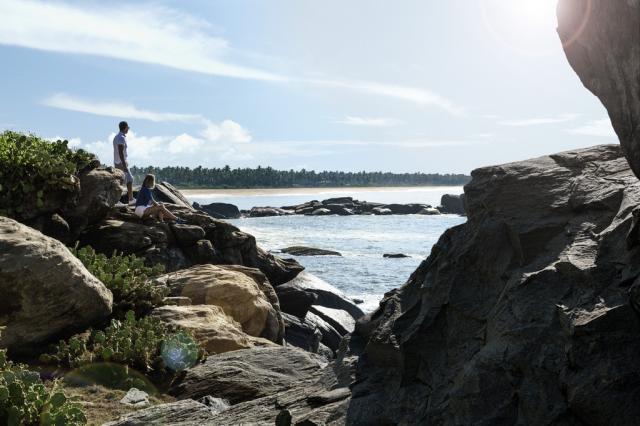 Guests Hiking looking at Resort Beach HR