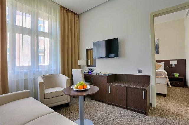 dvoulůžkový pokoj a denní místnost - typ Apartmán 2(+1) Comfort
