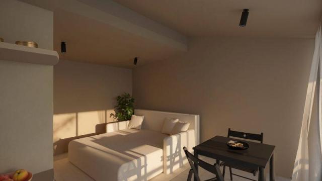 Holiday homes Kačjak - rozkládací gauč, jídelní stůl.