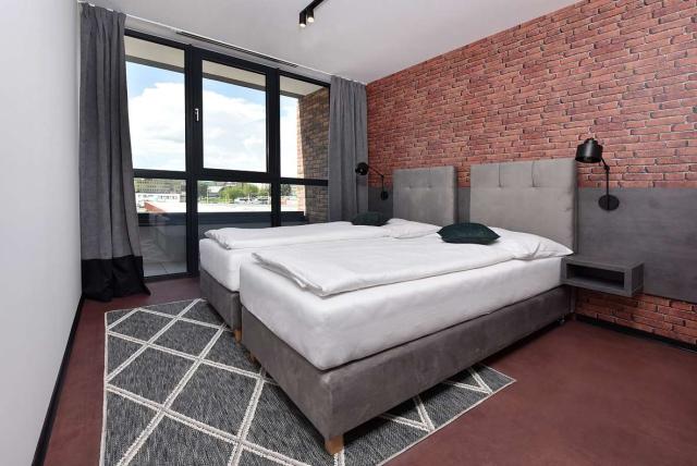 Dvoulůžkový apartmán se dvěma přistýlkami s balkonem