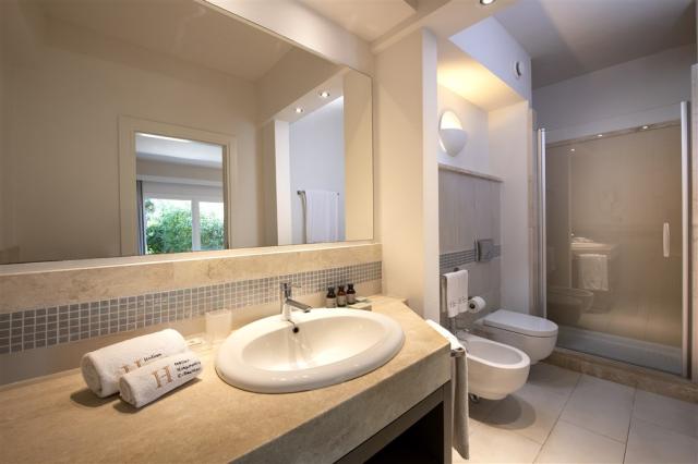 Chia Laguna_Hotel Village_Pool Room_Bathroom with shower.jpg