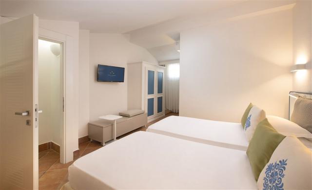Chia Laguna_Hotel Village_Pool Family Room3_Upper Floor Bedroom