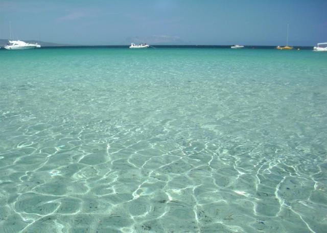 Iss Travel Bouganvillage Spiaggia Porto Ainu.jpg
