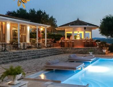 hotelnefeli-pool-bar-evening-394x303.jpg
