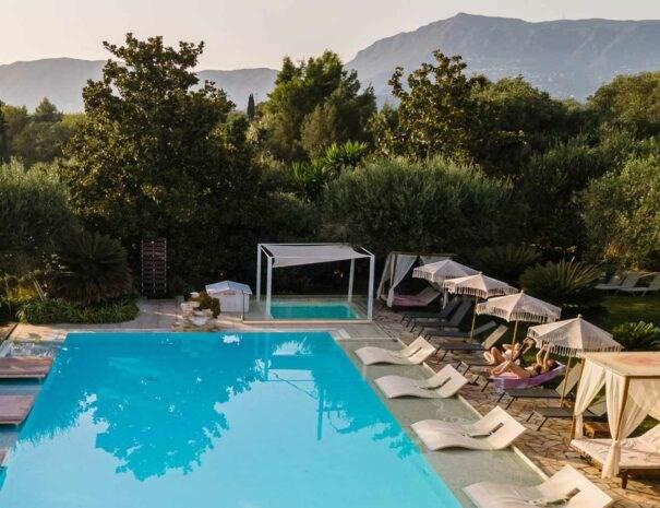 hotelnefeli-sunbeds-pool-landscape-605x465.jpg